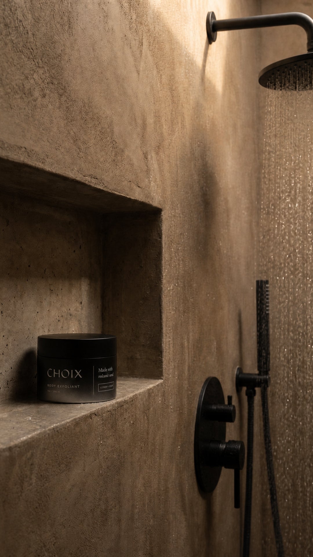 CHOIX body exfoliant on a shelf inside a shower