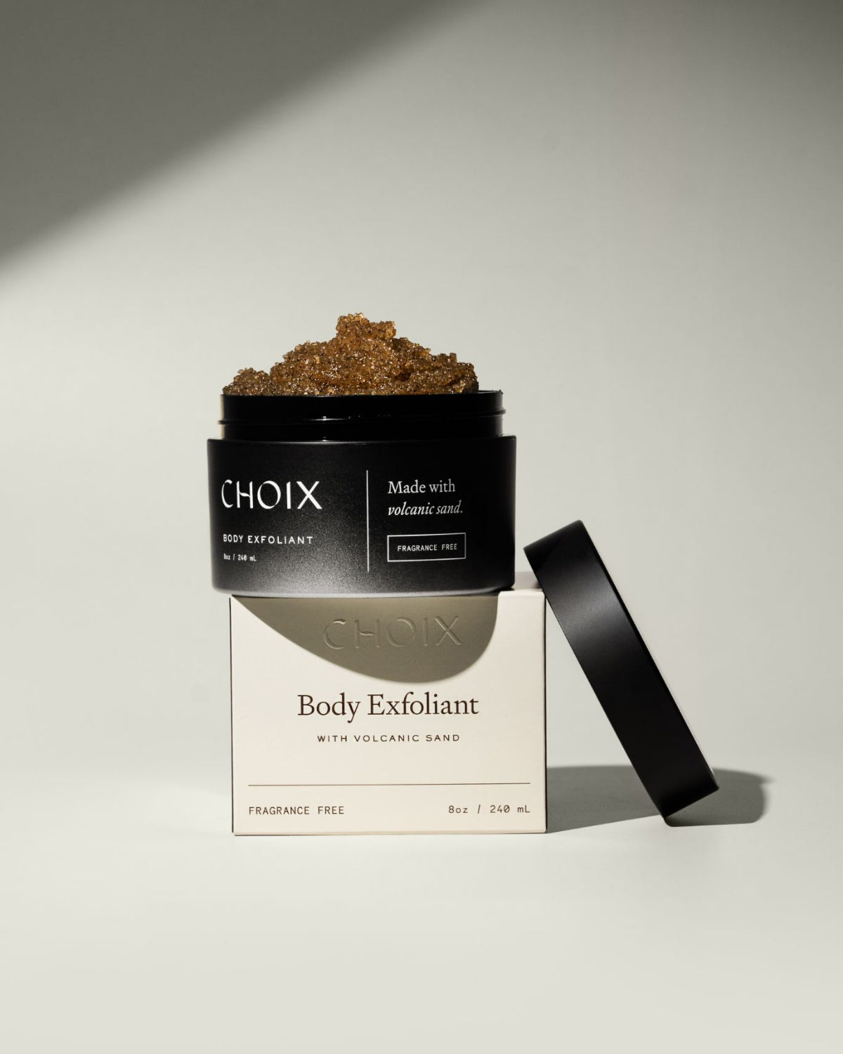 CHOIX fragrance free body exfoliant jar with open lid  and box on a white background